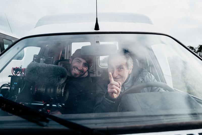 View through car windshield of Brieuc Segalen DOP sitting with Guy