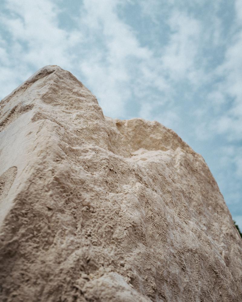 Uncut stone block against blue sky