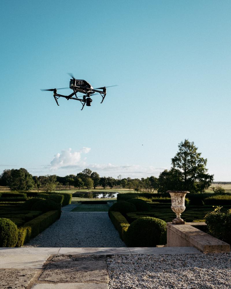Drone flying over garden at chateau Calon Ségur