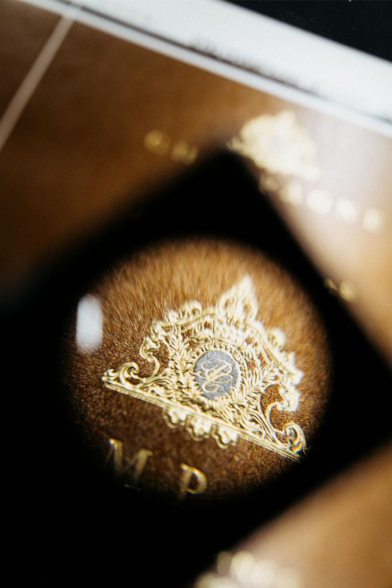 Close up of magnifying glass used to check crest on De Lozey label