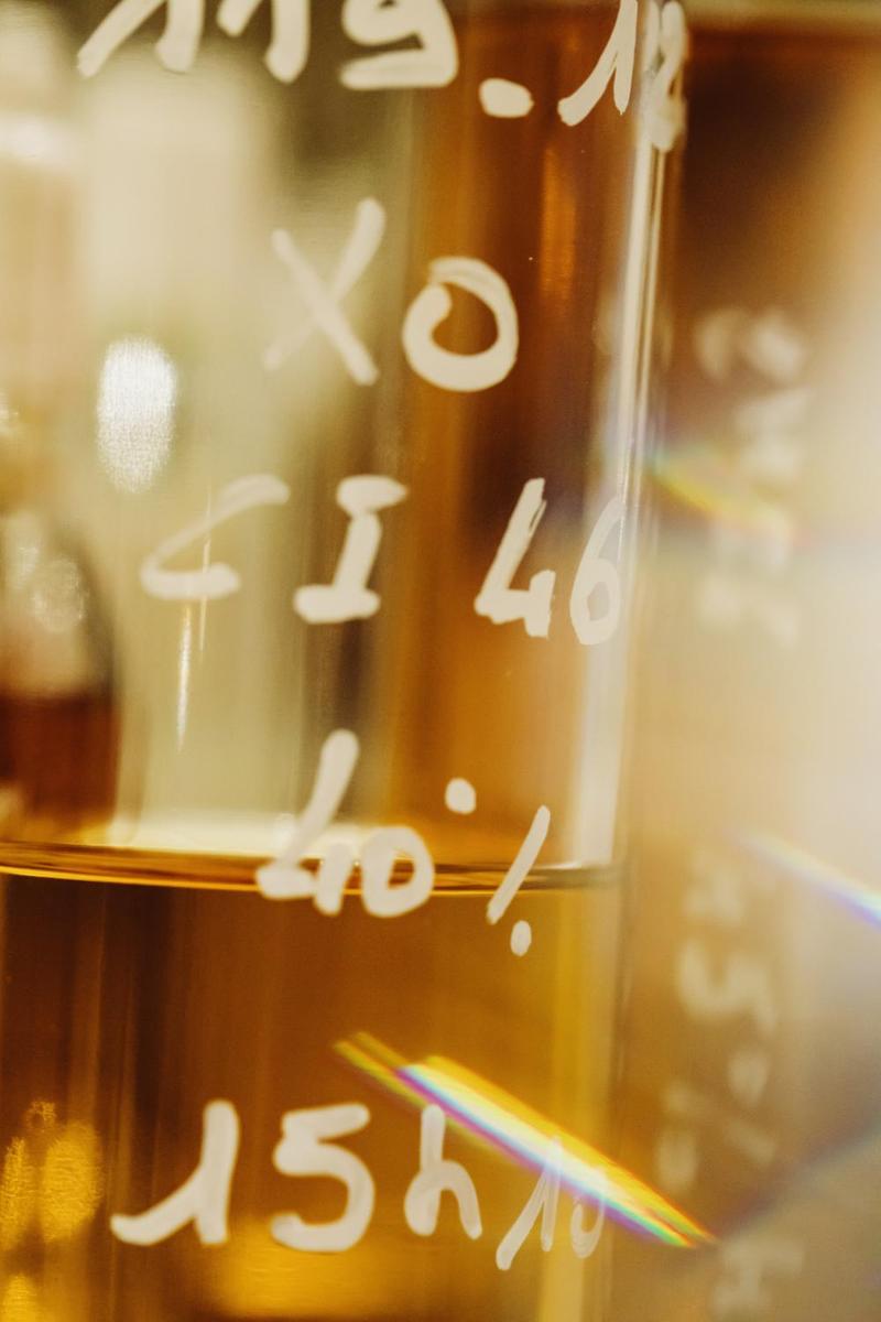 Close up of bottles of Cognac samples to be blended together with artistic prism effect
