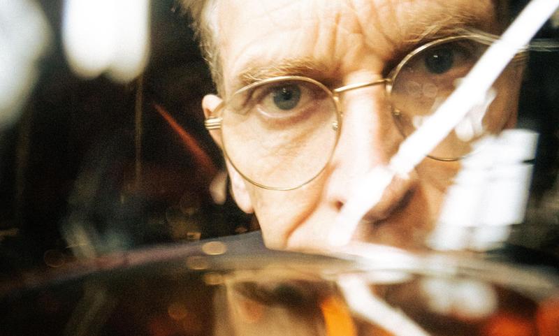 Close up of the eye of Delamain Cellar Master Charles Braastad inspecting the Cognac eaux-de-vie in a glass