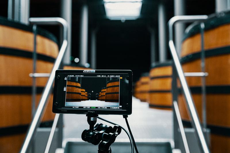 close up of video monitor showing oak vats inside Fieuzal's winery
