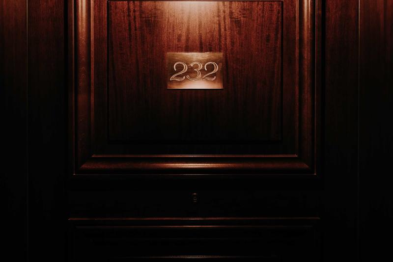 Close up of number 232 on bedroom door of the Bordeaux Grand Hotel
