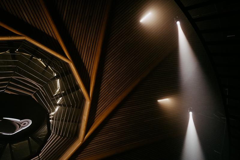 Le Dôme atrium at night lit up with spotlights for film shoot