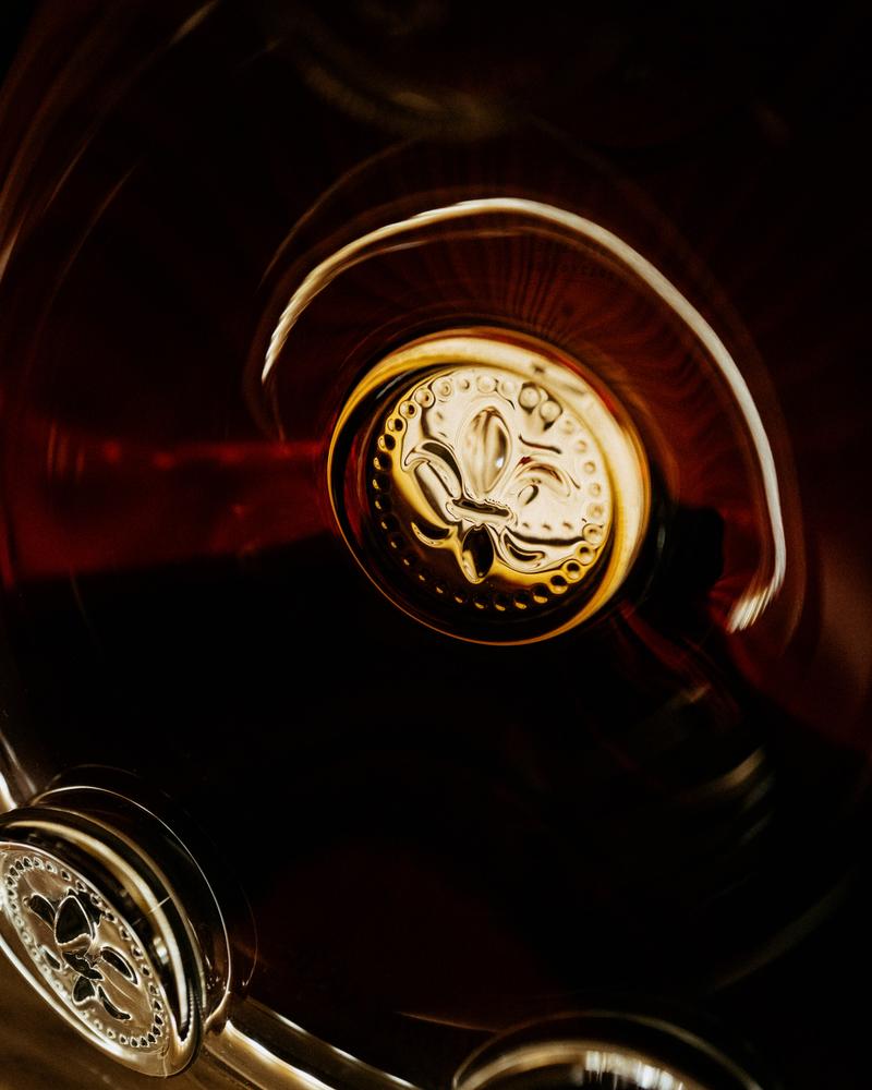 Close-up of fleur-de-lys on LOUIS XIII decanter