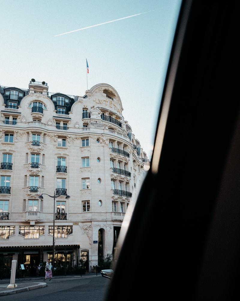 View out of taxi window of the façade of Hotel Lutetia, Paris
