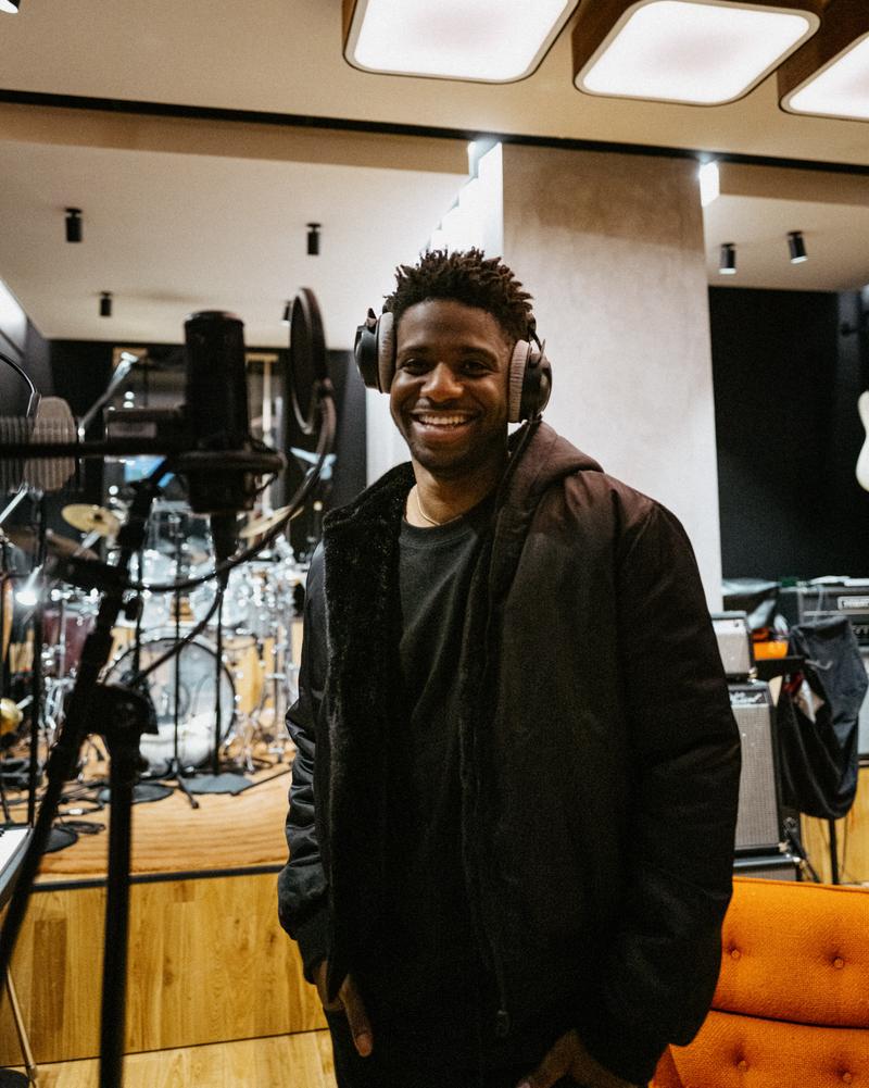Portrait of Samuel Arnold smile during voice over recording
