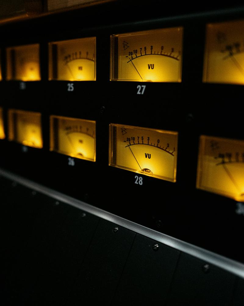 Close up of sound meters on a mixing console at Sodasound Paris