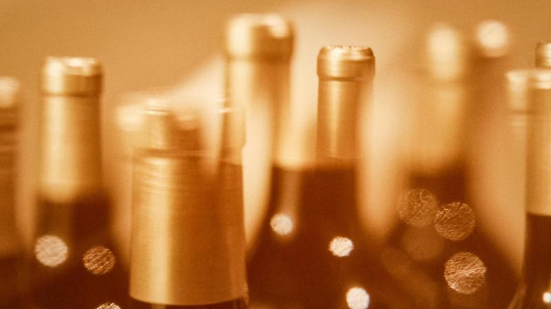 Macro of Pichon Comtesse wine bottle capsules with movement blur