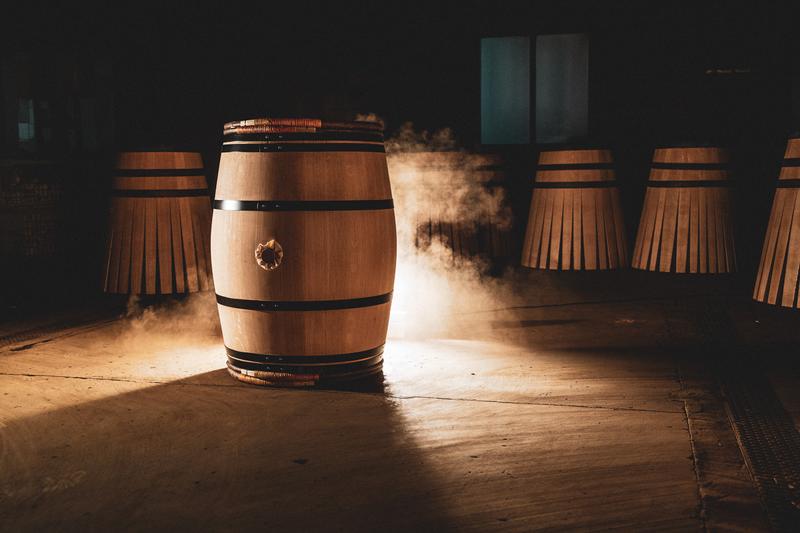 Taransaud barrel sat in cooperage surrounded by cloud of dust